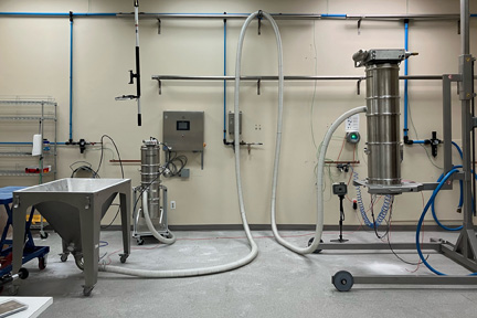 In the Volkmann test lab Bristol, PA showing pneumatic vacuum conveying system