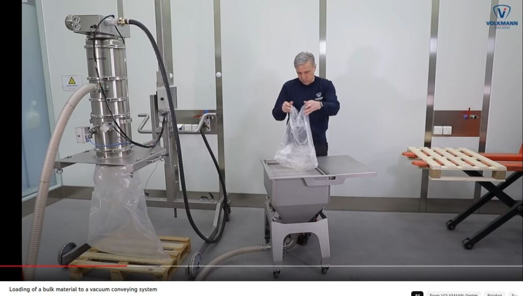 Volkmann pneumatic vacuum conveying system loading bulk material into RNT bag dump station