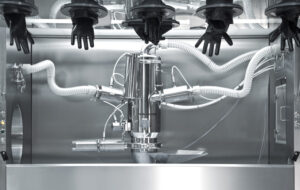 Volkmann pneumatic vacuum conveyor set inside a glove box for containment
